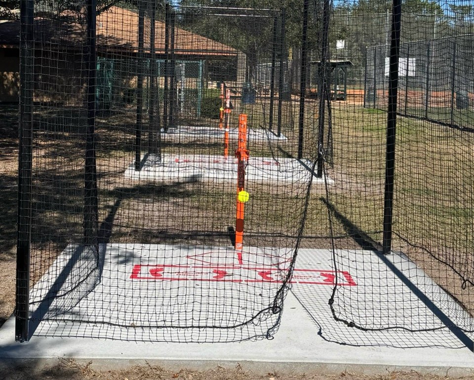Close view of a Beast Hack station inside its netting enclosure at Red Bug Lake Park