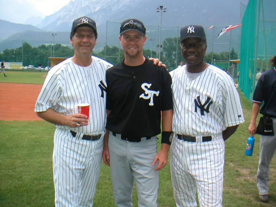 Keaton Smith with former New York Yankees Larry Massaroni and Paul Blair on a baseball field in Austria