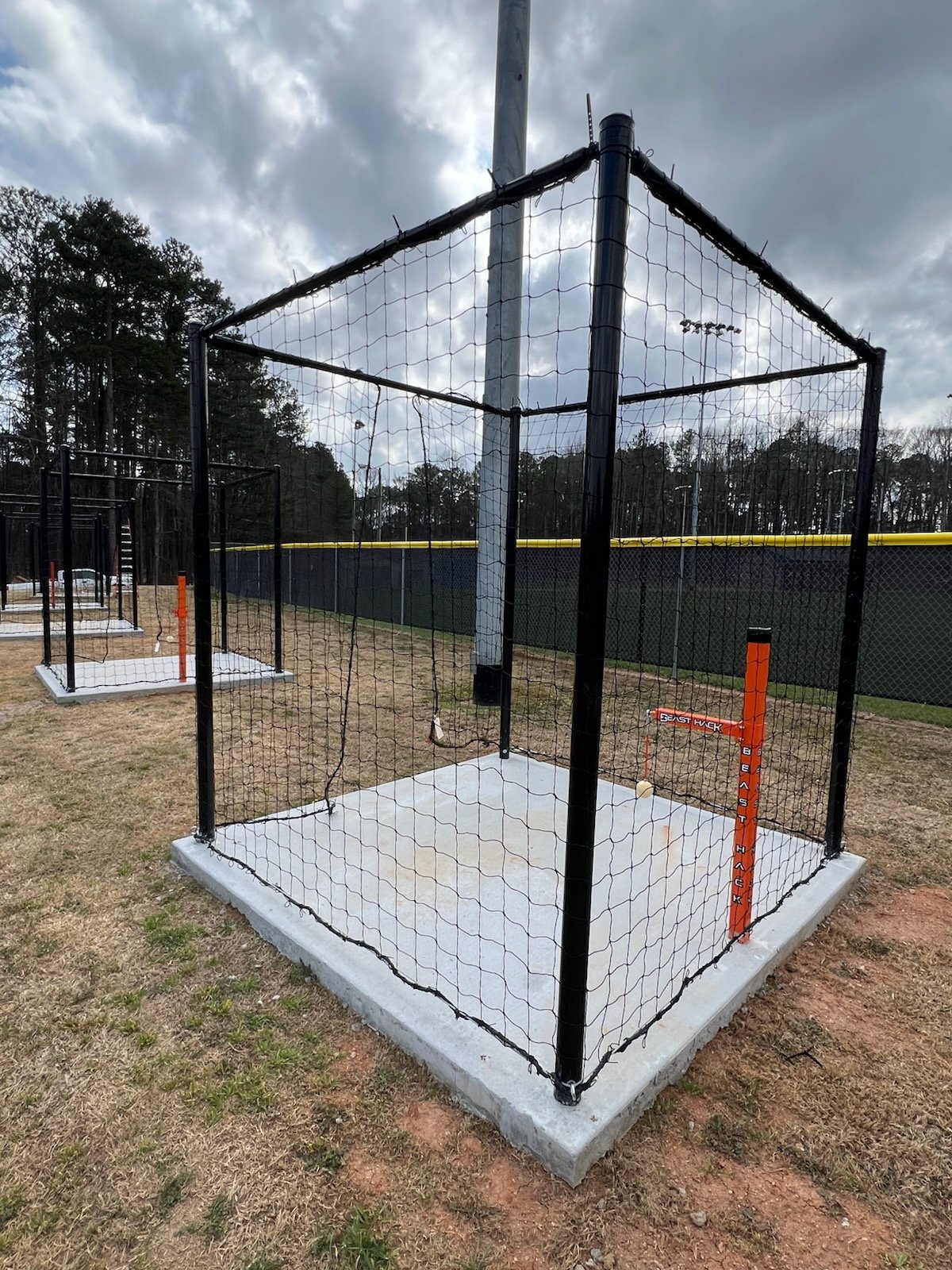 Baseball player using Beast Hack hitting station